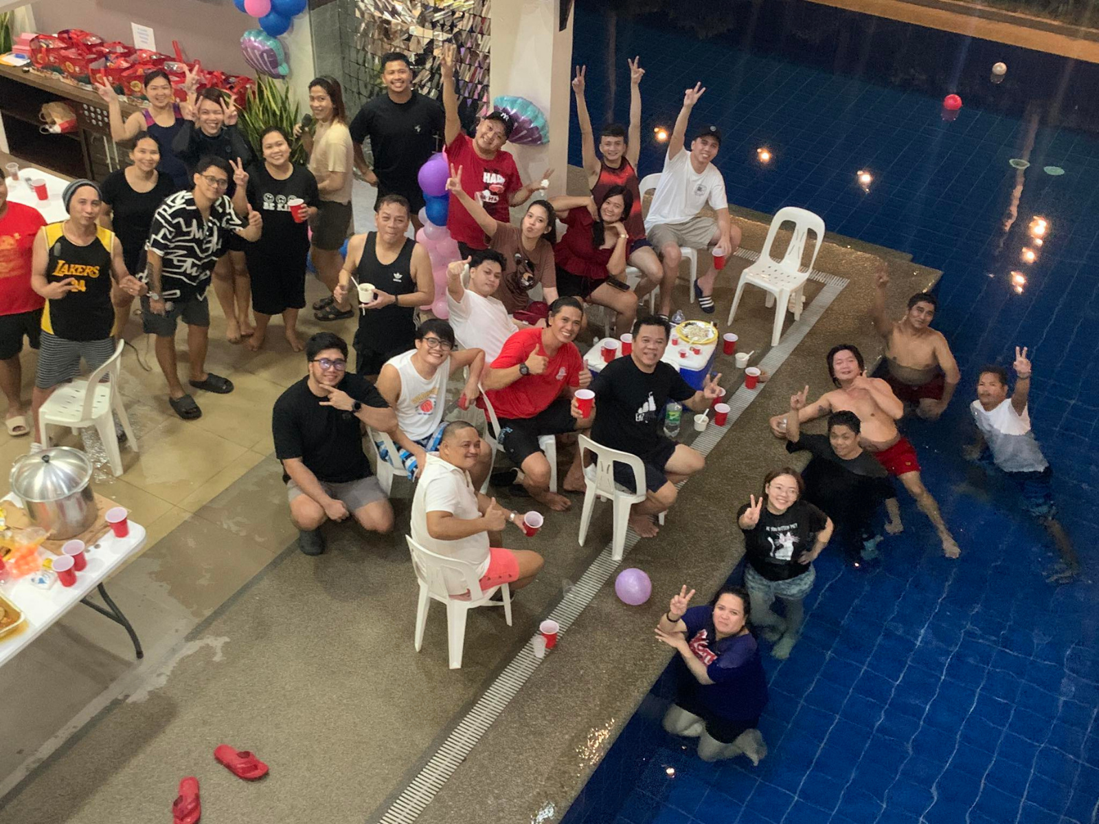 Southern Experts team celebrating beside a pool