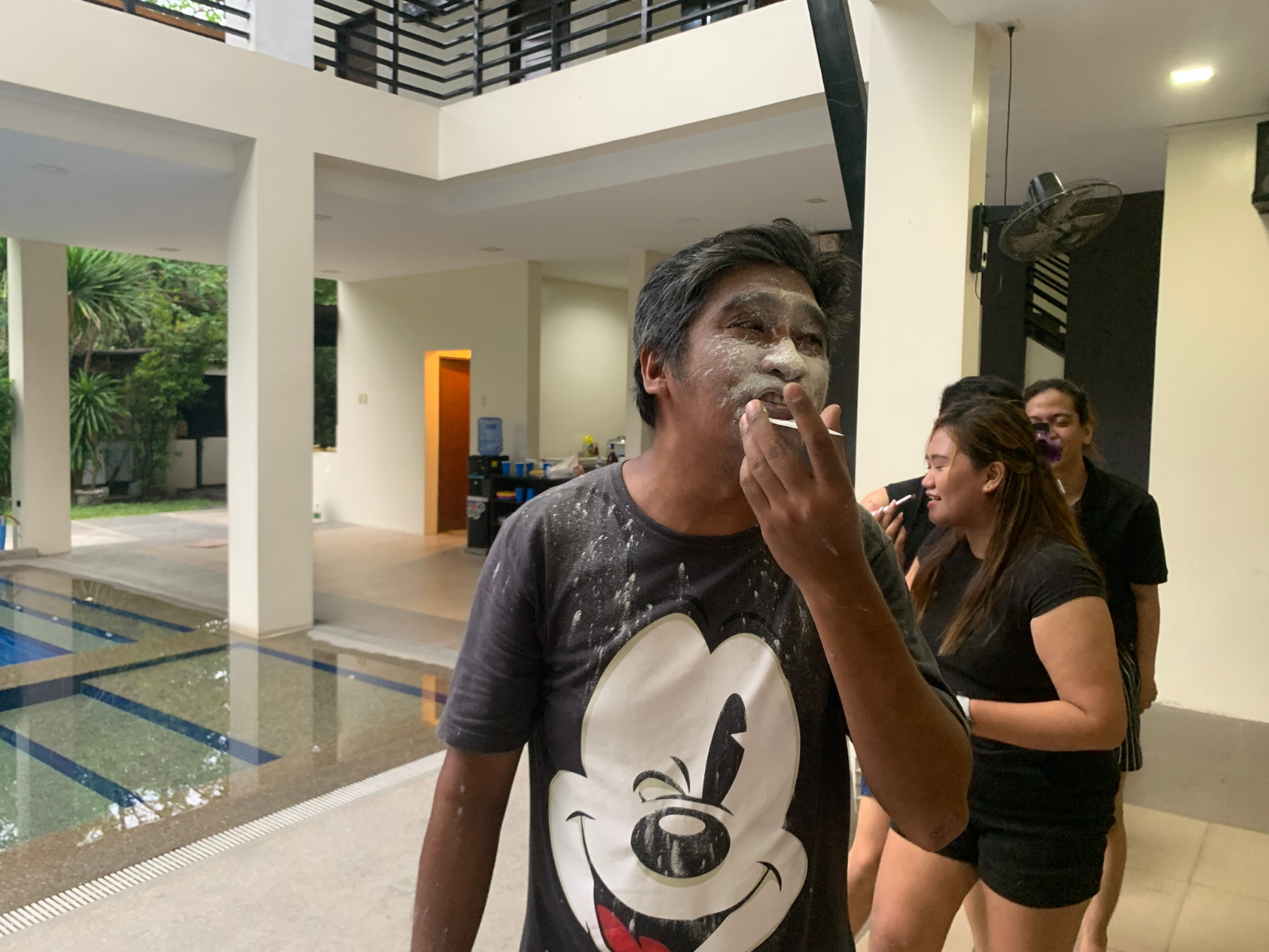 Teammates enjoying a flour game