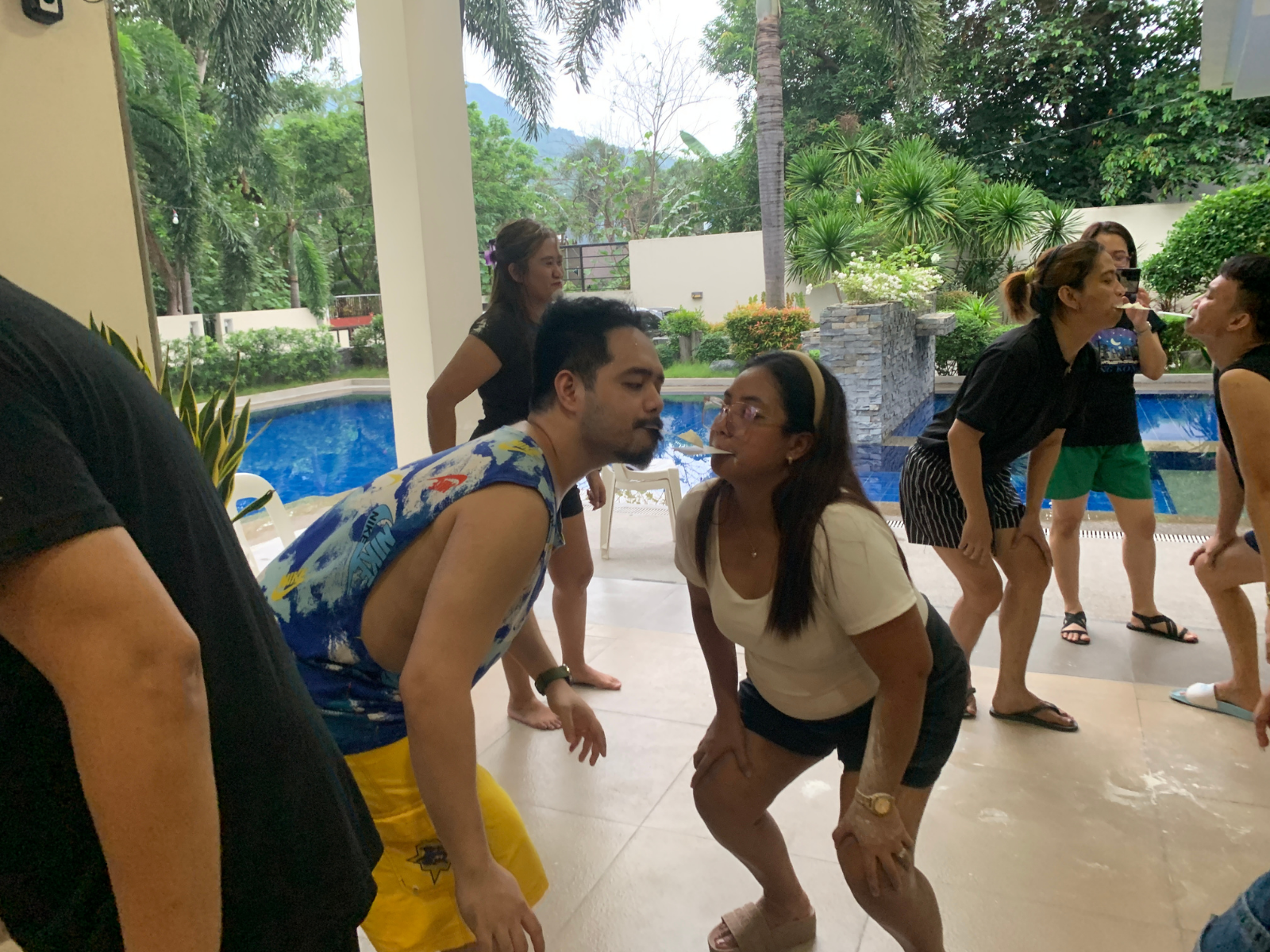 Teammates playing a poolside game